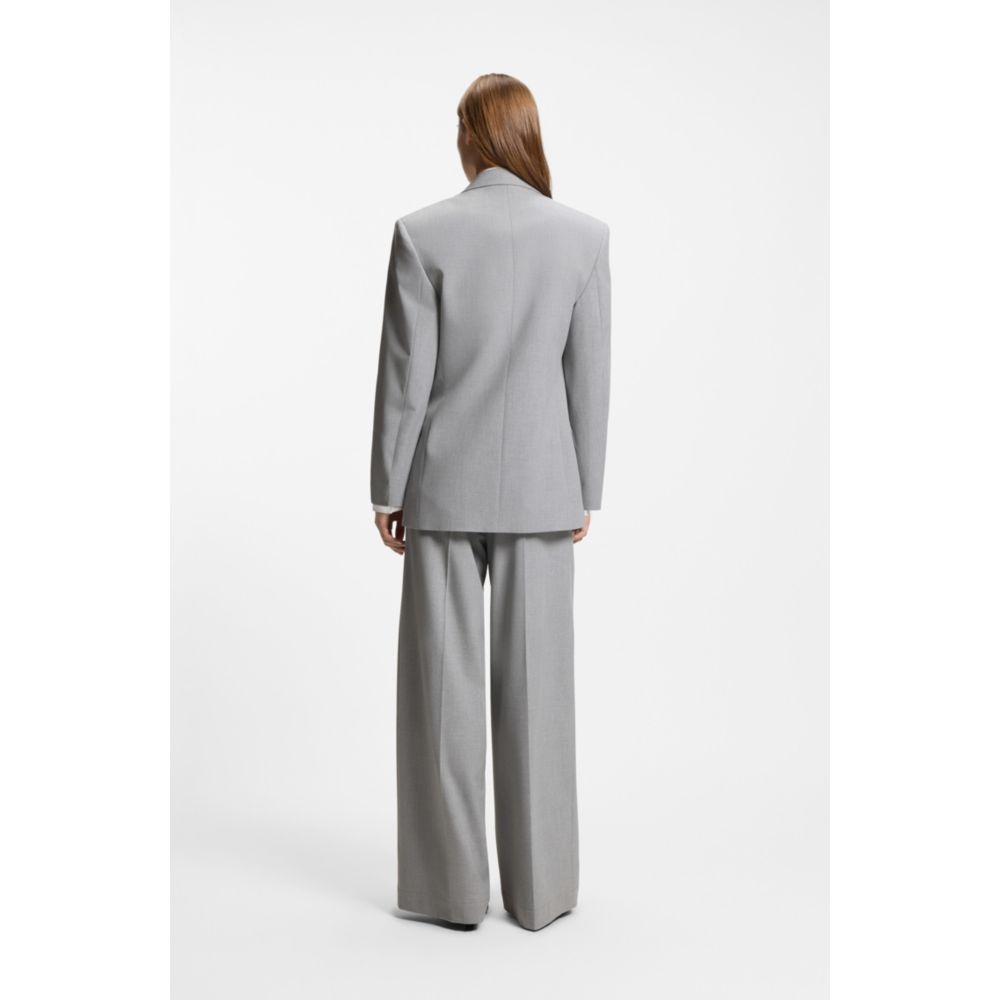 Relaxed-fit blazer with enamel flower brooch