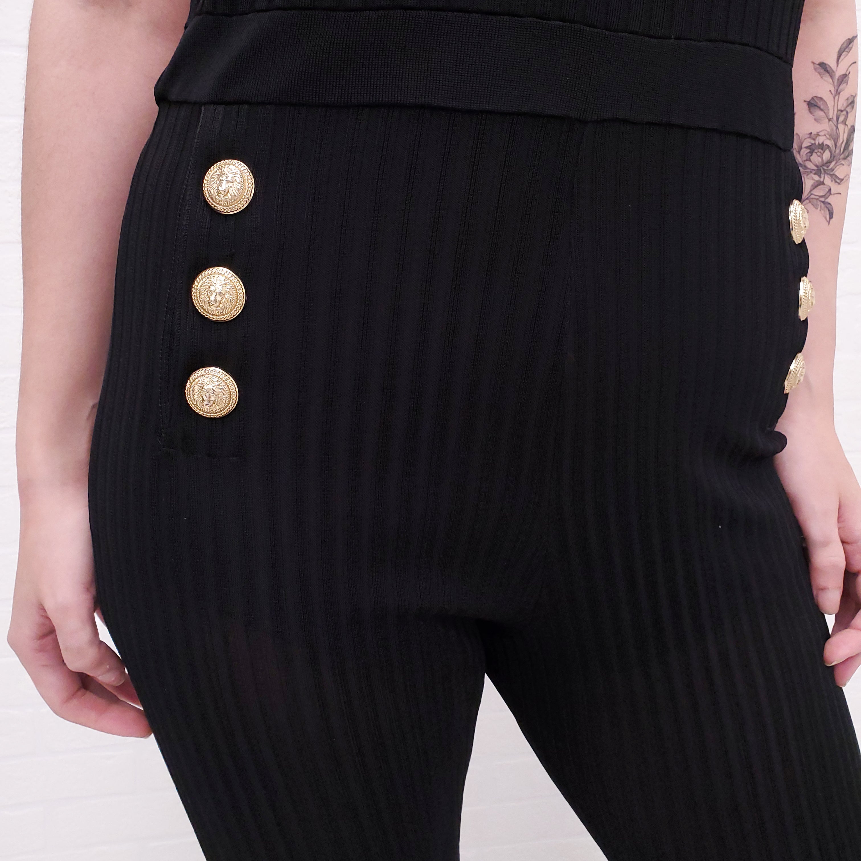 BALMAIN BLACK RIBBED JUMPSUIT WITH GOLD LOGO BUTTONS - SIZE 44