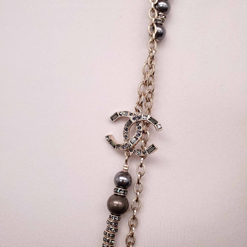 CHANEL GOLD, BRONZE, AND GREY LAYERED PEARL NECKLACE WITH CRYSTAL LOGOS