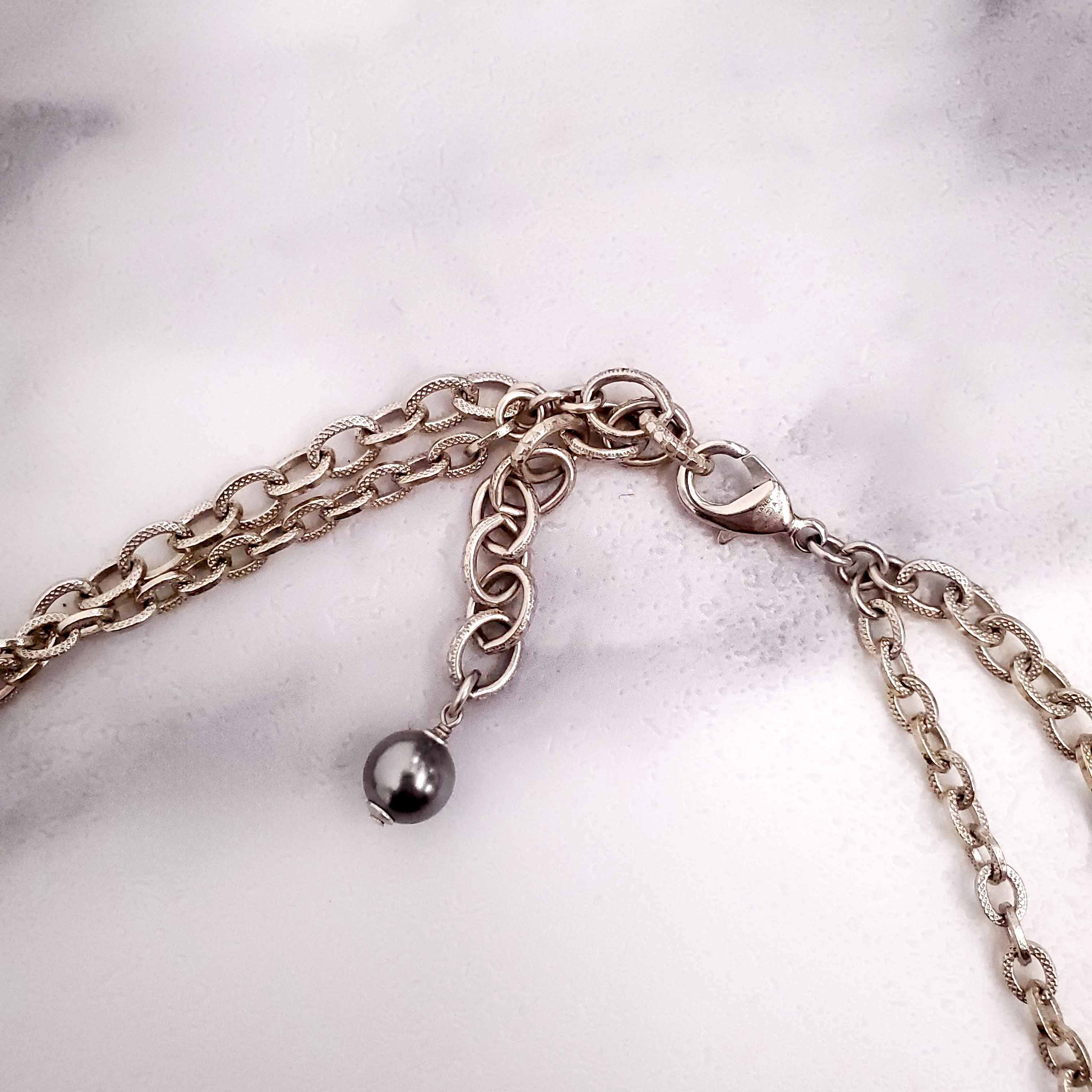 CHANEL GOLD, BRONZE, AND GREY LAYERED PEARL NECKLACE WITH CRYSTAL LOGOS