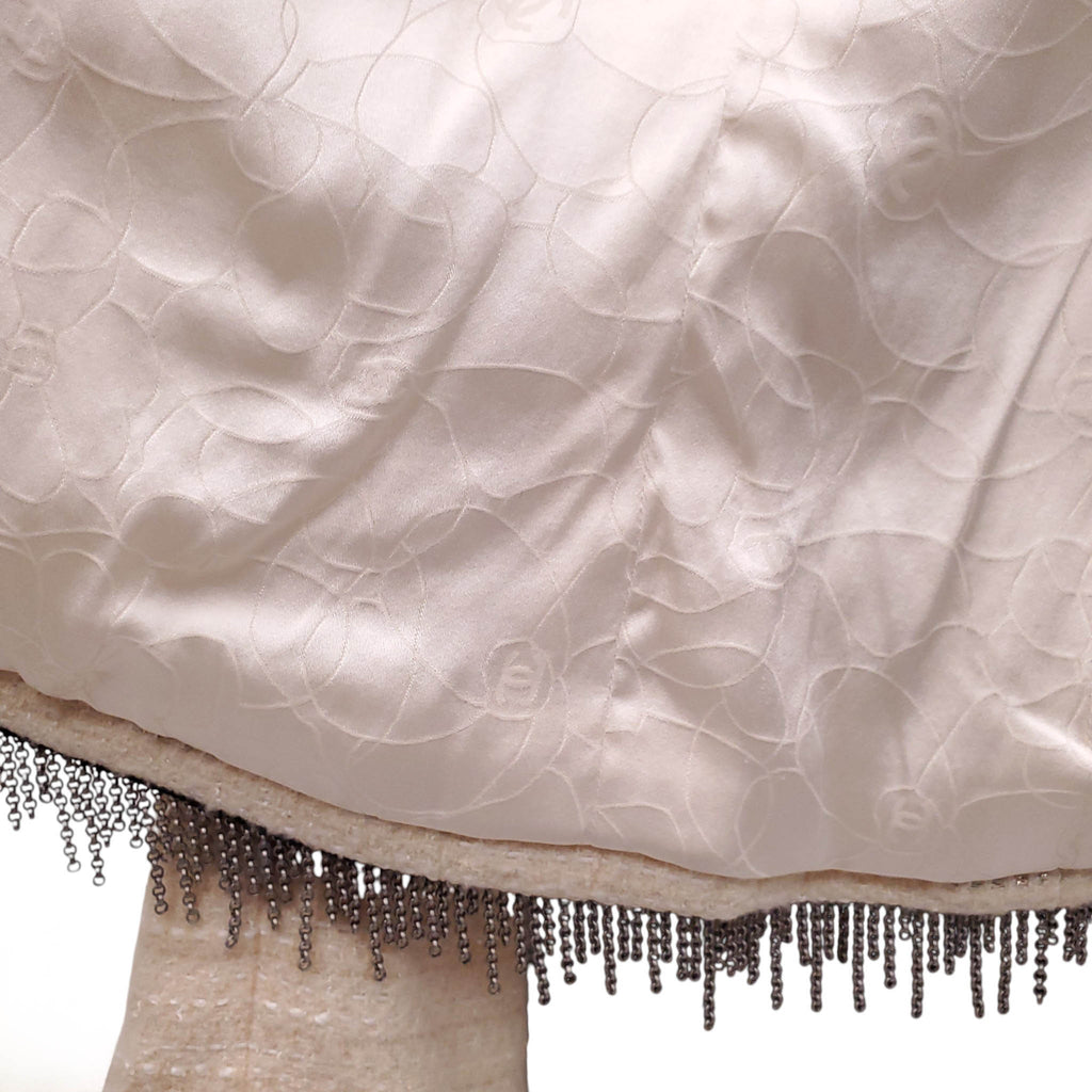CHANEL CREAM AND BLACK TWEED CHAIN FRINGE TRIMMED JACKET WITH OWL BUTTONS - SIZE 38