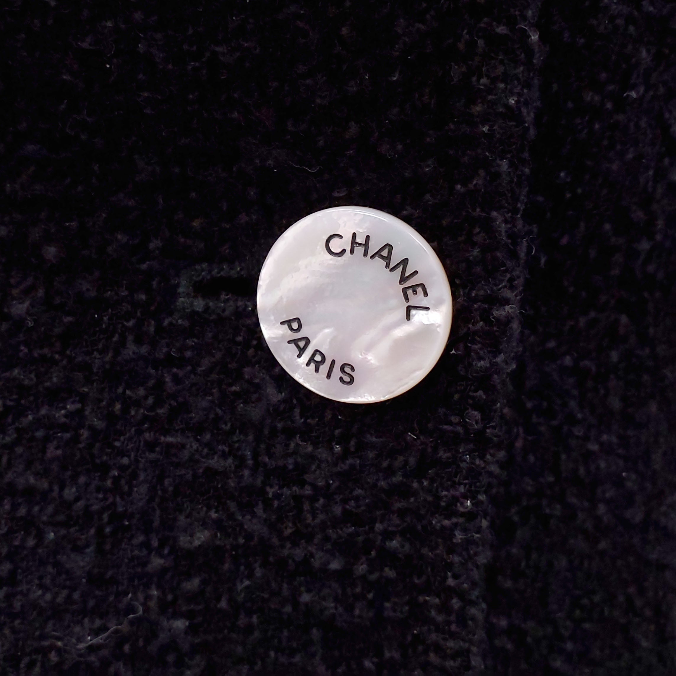 CHANEL BLACK PEPLUM TWEED JACKET WITH MOTHER OF PEARL LOGO BUTTONS AND SLEEVE ZIPPER - SIZE 38