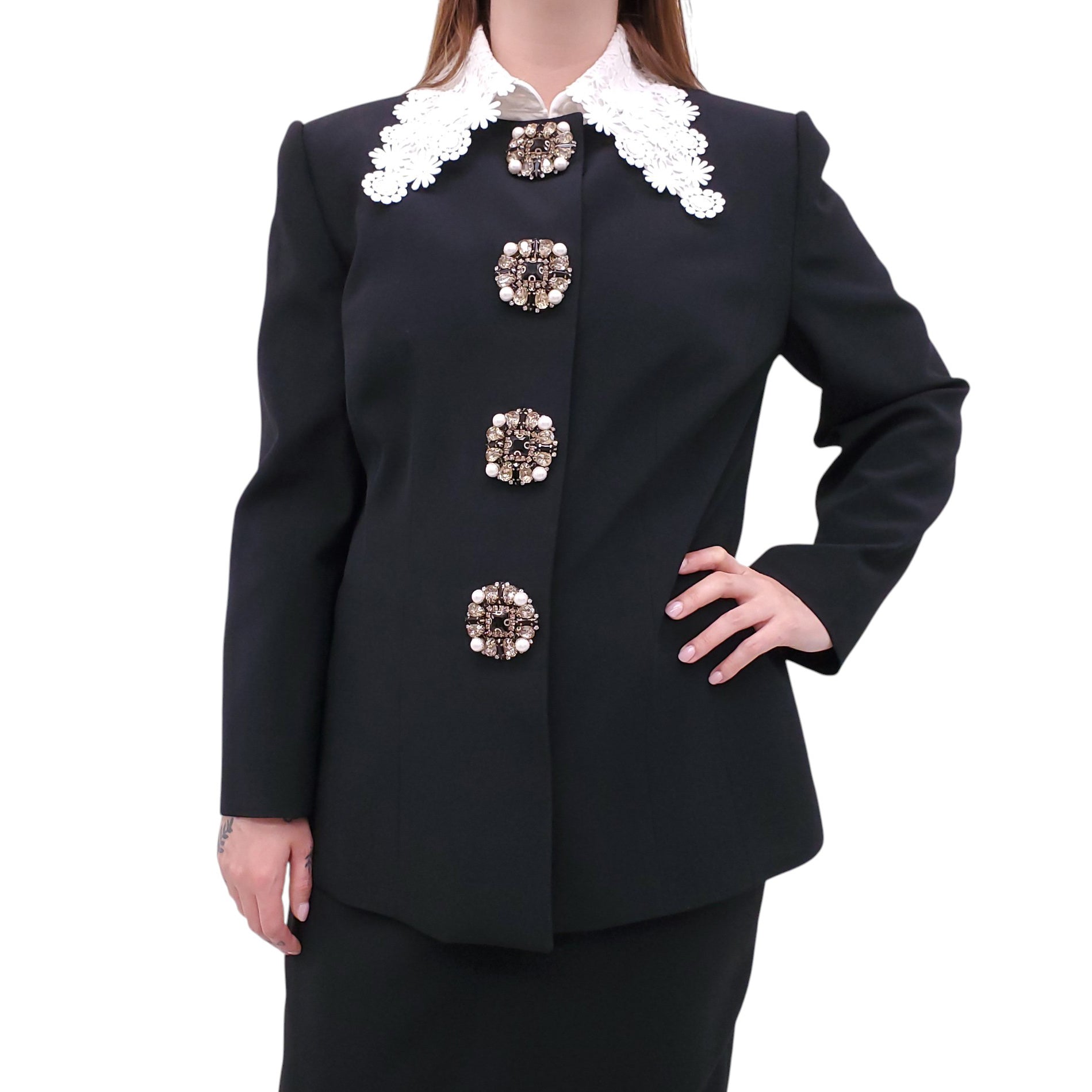 ANDREW GN BLACK SKIRT SUIT WITH FLORAL EYELET COLLAR AND CRYSTAL EMBLEM DETAILS - SIZE 46