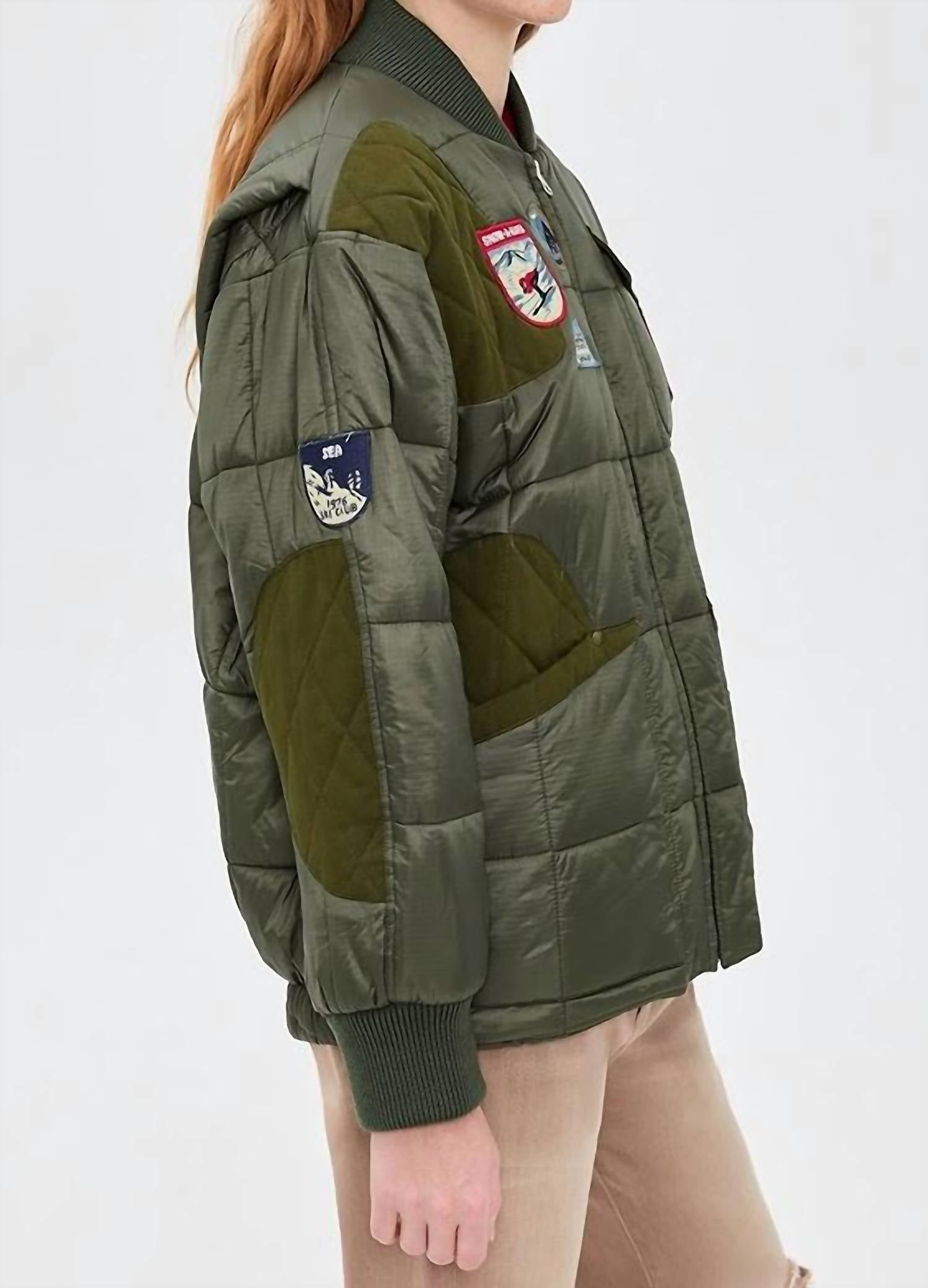 Eira Quilted Patched Puffer Jacket In Sea