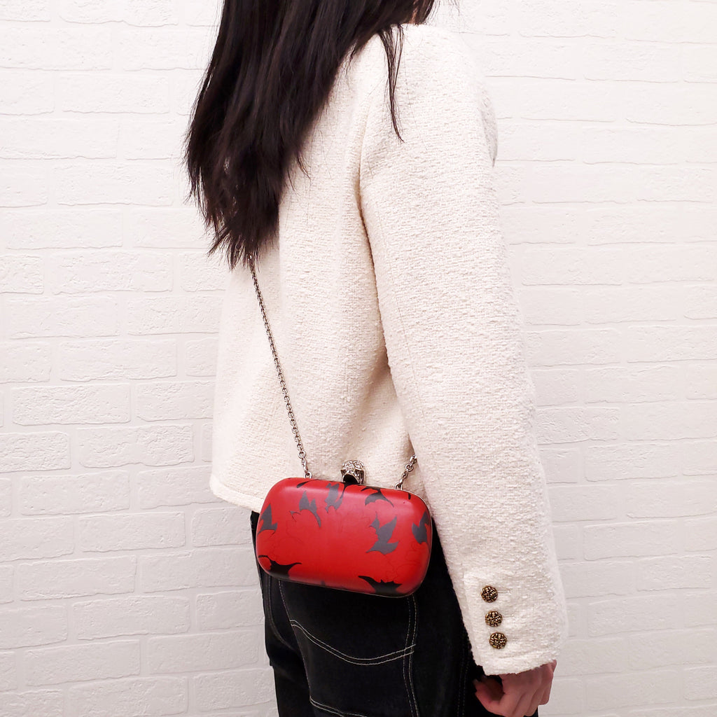 ALEXANDER MCQUEEN RED AND BLACK PATTERNED SKULLS CLUTCH