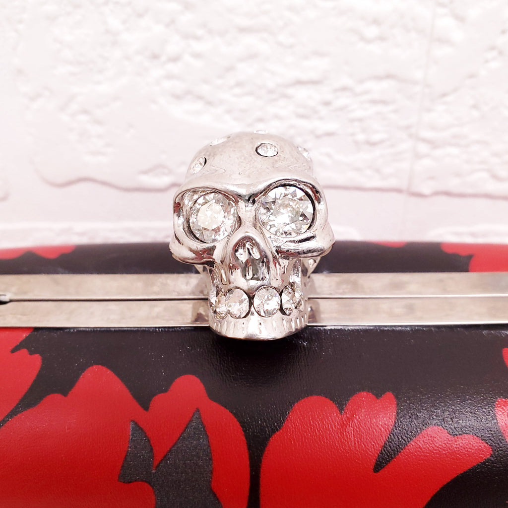 ALEXANDER MCQUEEN RED AND BLACK PATTERNED SKULLS CLUTCH