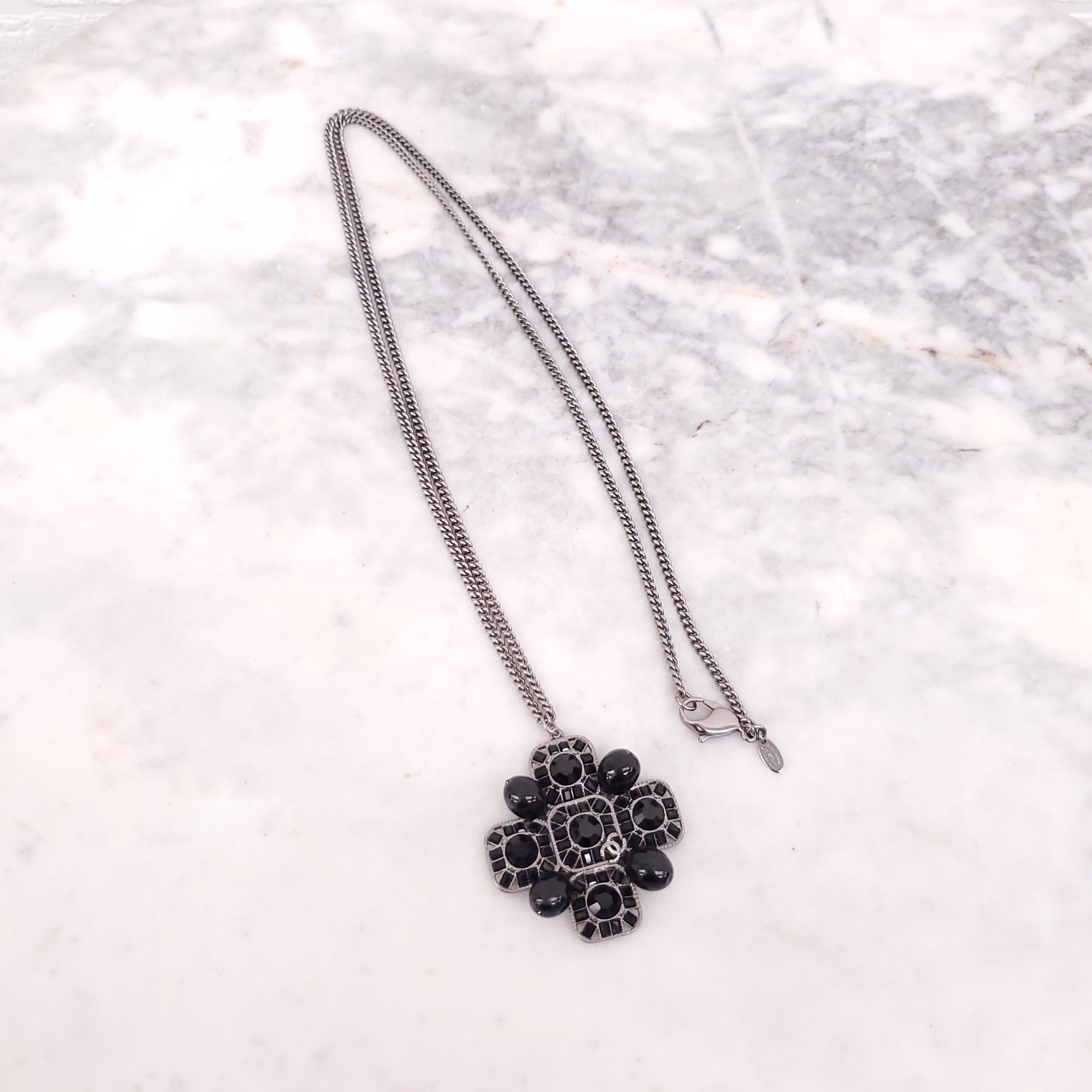 CHANEL BLACK CRYSTAL CROSS WITH LOGO