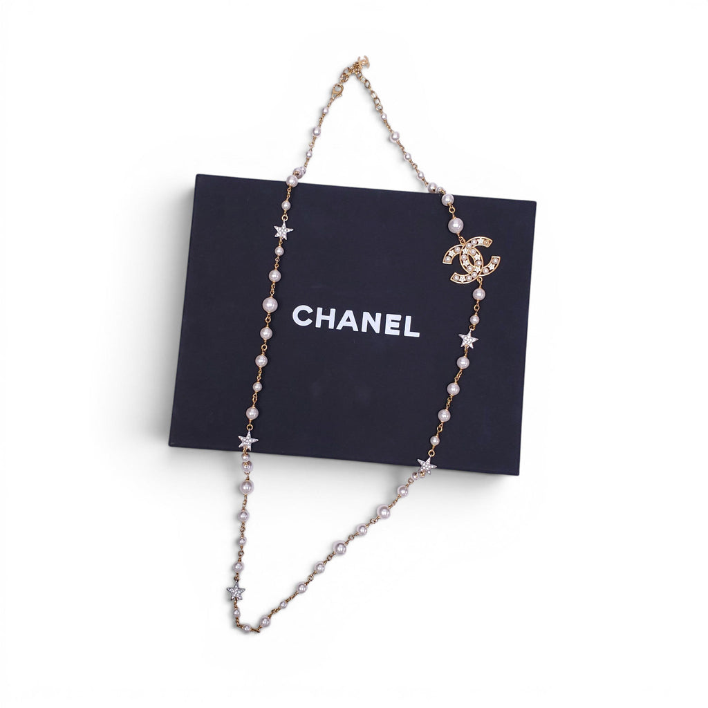 CHANEL GOLD NECKLACE WITH CREAM PEARLS, STARS, AND CC LOGO
