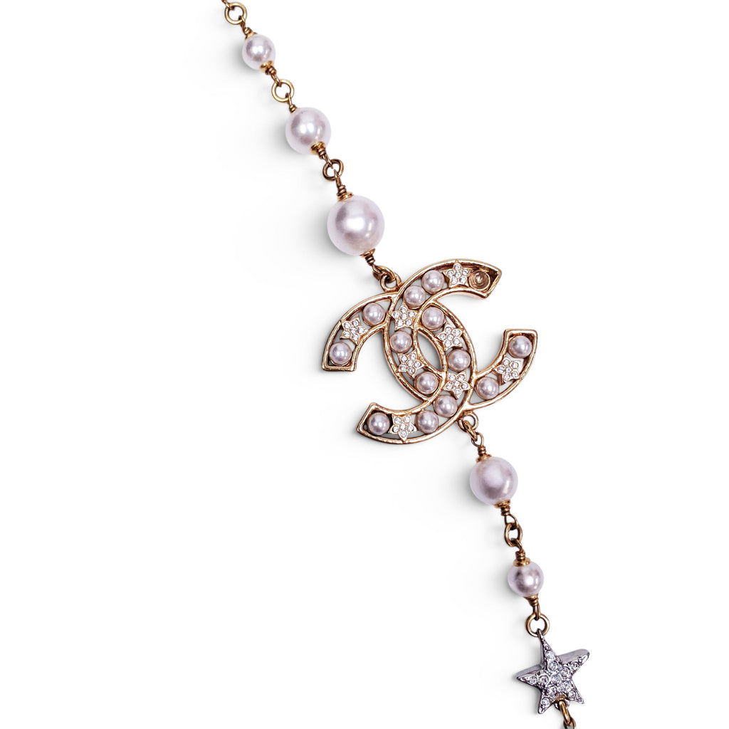 CHANEL GOLD NECKLACE WITH CREAM PEARLS, STARS, AND CC LOGO