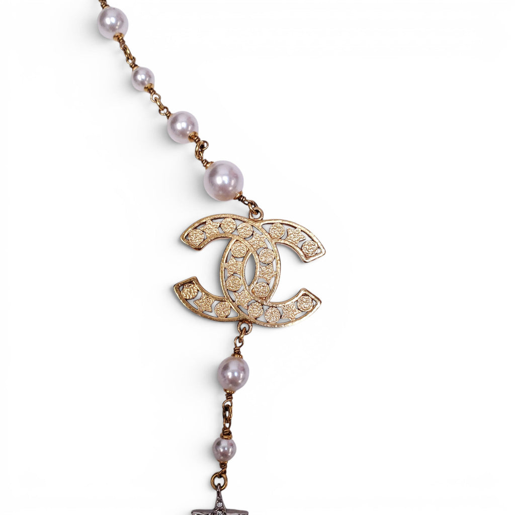CHANEL GOLD NECKLACE WITH CREAM PEARLS, STARS, AND CC LOGO