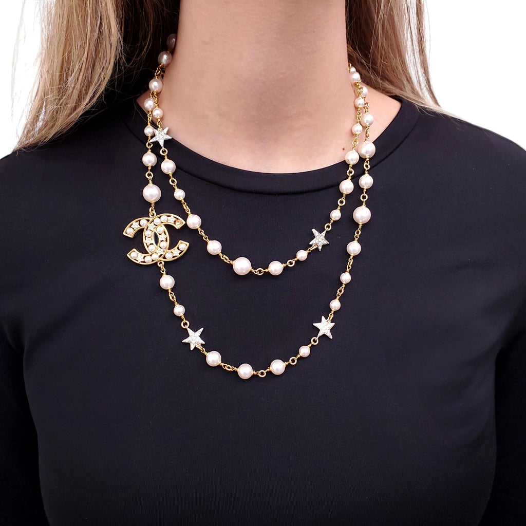 CHANEL GOLD NECKLACE WITH CREAM PEARLS, STARS, AND CC LOGO
