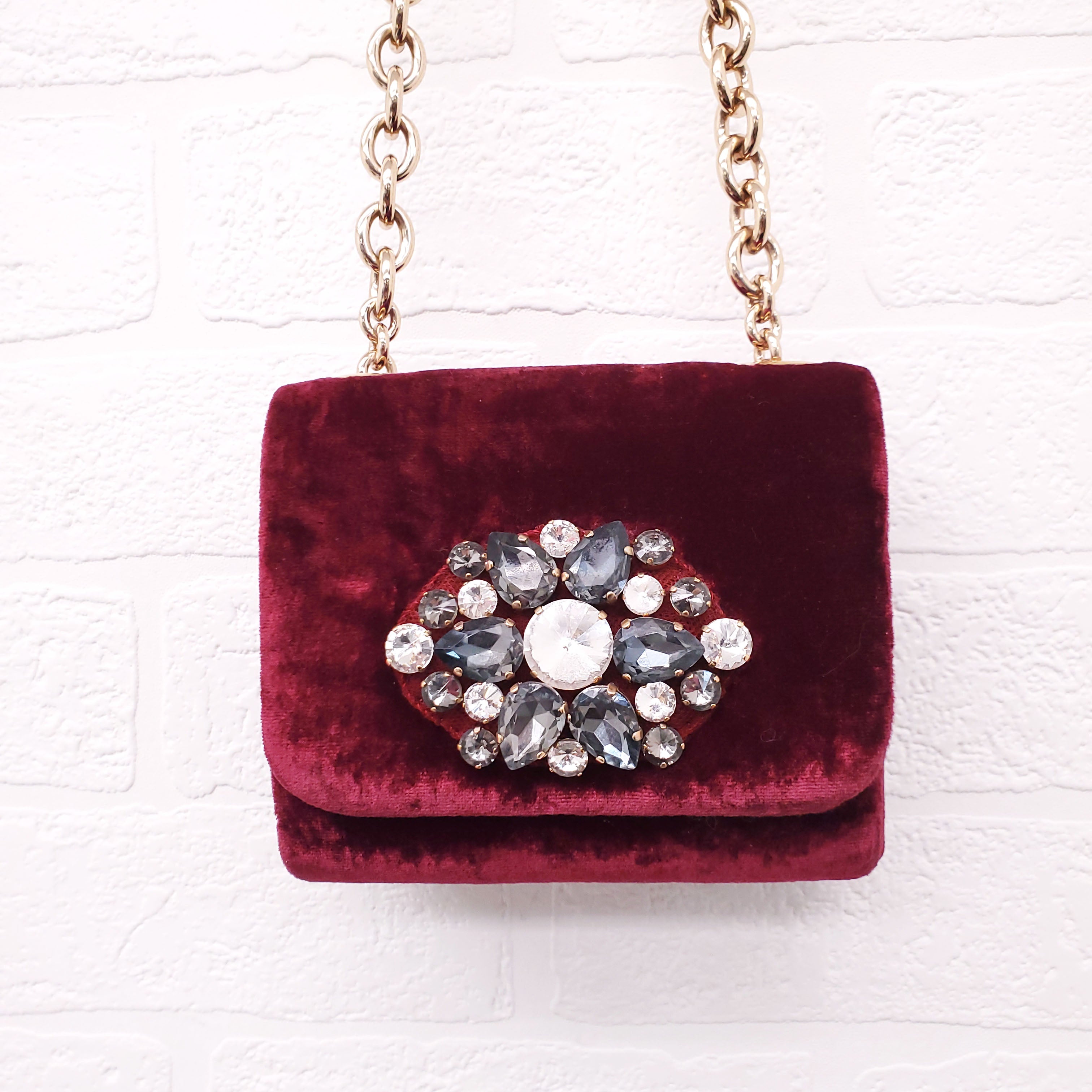 DOLCE & GABBANA BURGUNDY VELVET SHOULDER BAG WITH CRYSTAL EMBLEM